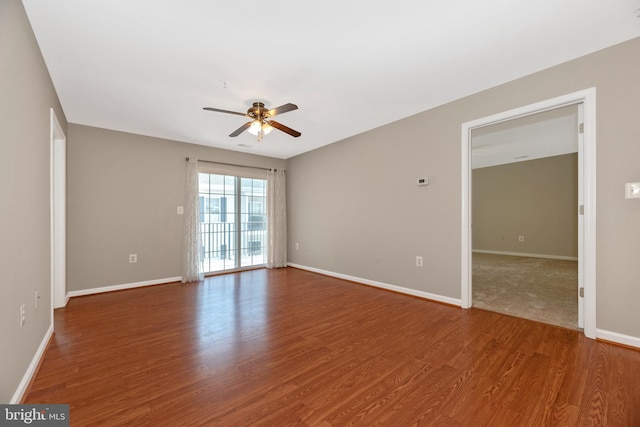 empty room featuring hardwood / wood-style flooring and ceiling fan