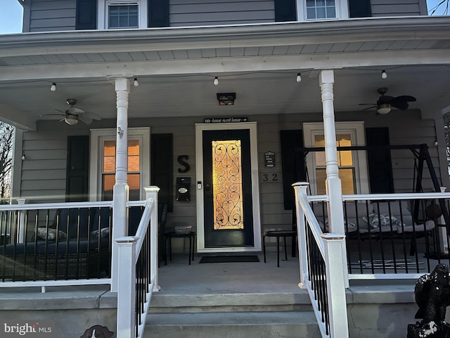 property entrance featuring ceiling fan and a porch