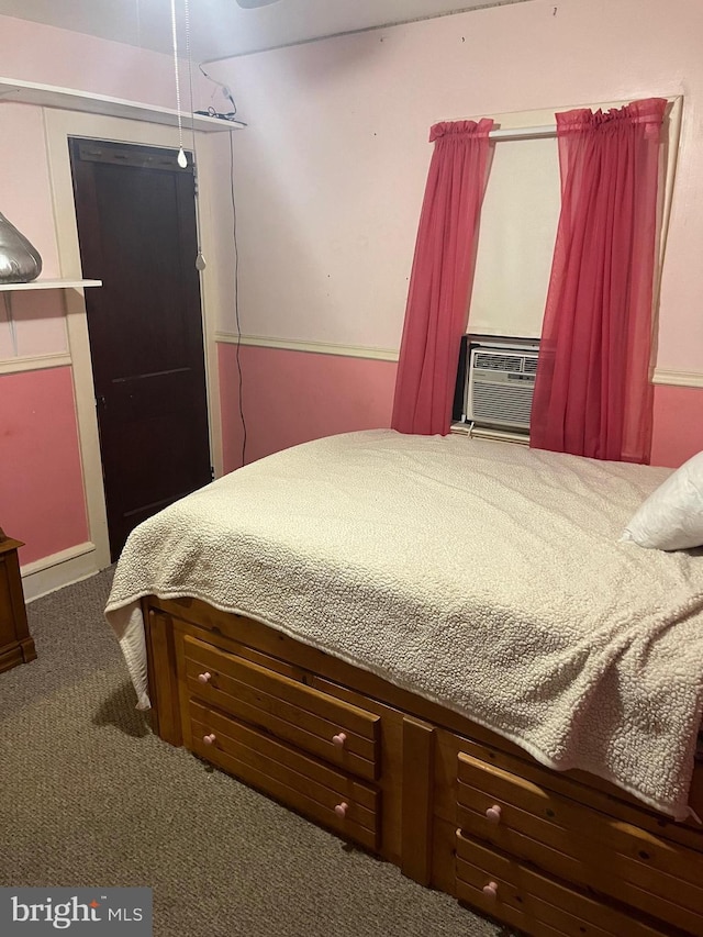 bedroom featuring cooling unit and dark colored carpet