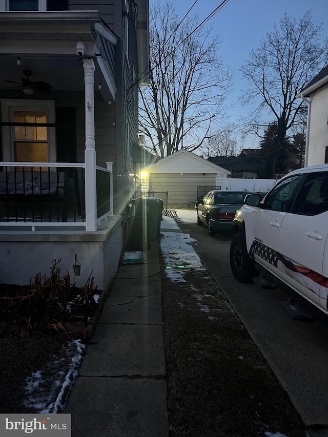 property exterior at dusk featuring covered porch