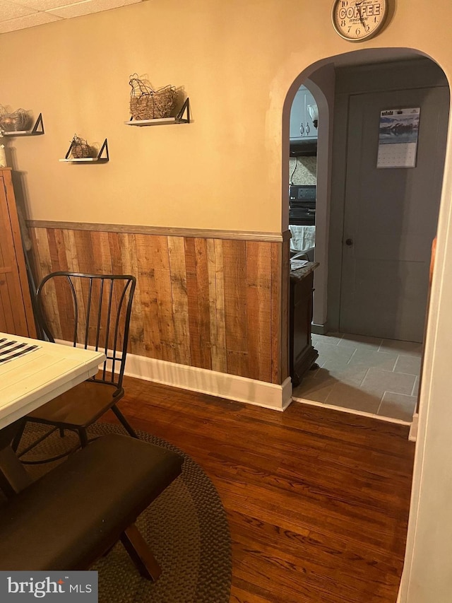 interior space featuring wood walls and wood-type flooring