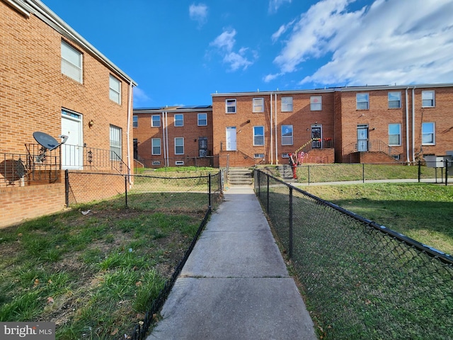 view of home's community featuring a lawn