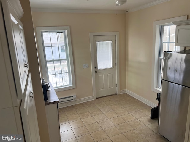 doorway with light tile patterned flooring, ornamental molding, and a baseboard heating unit