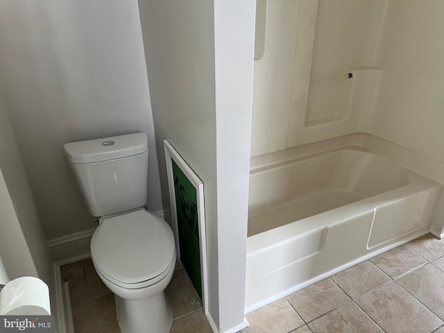 bathroom with tile patterned flooring and toilet