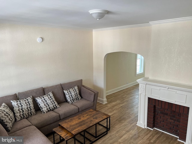 living room with hardwood / wood-style floors and crown molding