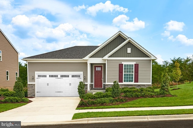 craftsman inspired home with a garage and a front yard