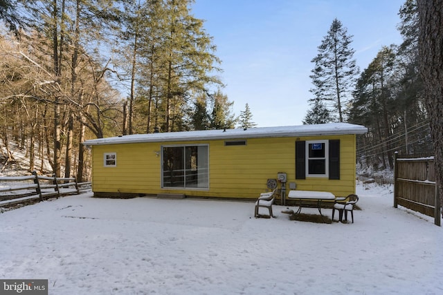 view of snow covered house