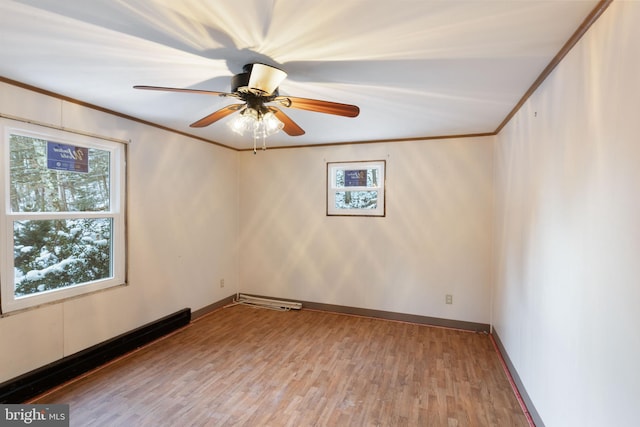 unfurnished room featuring ceiling fan, wood-type flooring, and ornamental molding