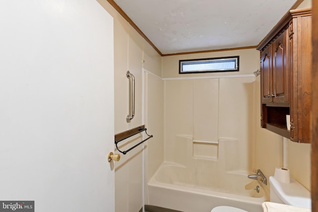 bathroom featuring washtub / shower combination and toilet