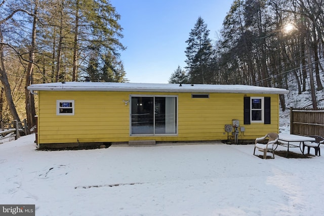 view of snow covered house