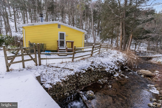 view of snow covered house