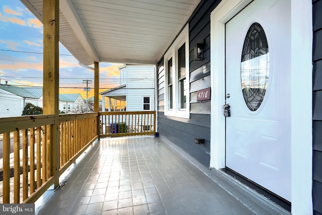 balcony at dusk with a porch