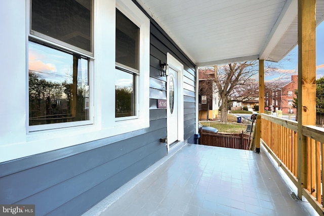 balcony at dusk with covered porch