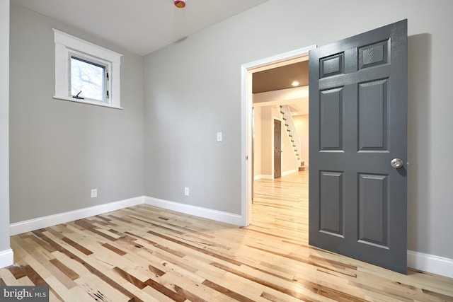 unfurnished room featuring light hardwood / wood-style floors