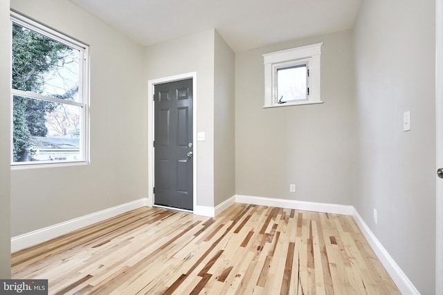 spare room featuring light hardwood / wood-style flooring