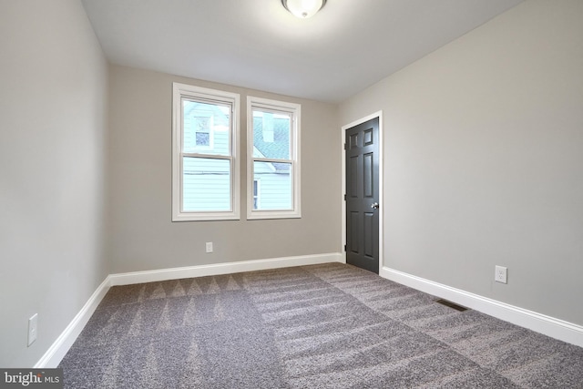 unfurnished room featuring carpet floors