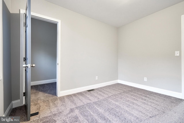 unfurnished room with carpet floors