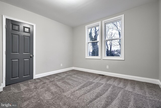 spare room featuring carpet flooring