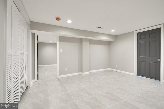 basement featuring light tile patterned floors