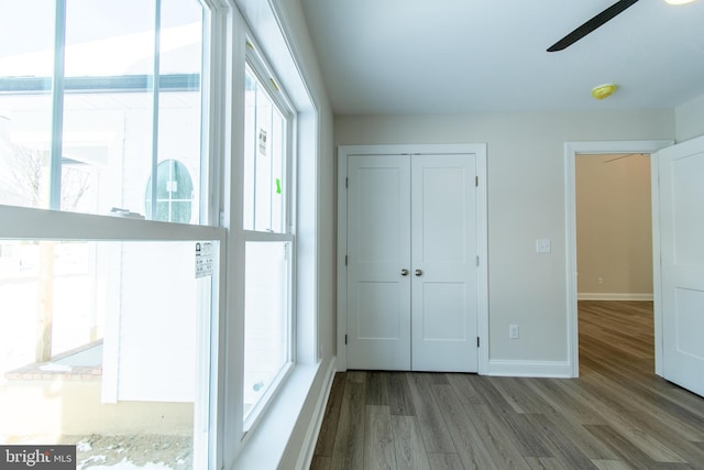 unfurnished bedroom featuring ceiling fan and light hardwood / wood-style floors