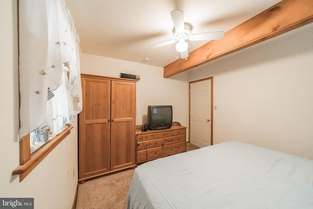 bedroom featuring light carpet and ceiling fan