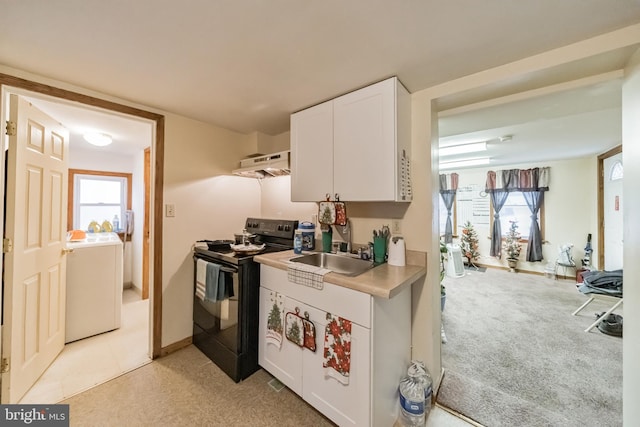 kitchen featuring light colored carpet, plenty of natural light, black range with electric cooktop, and white cabinetry