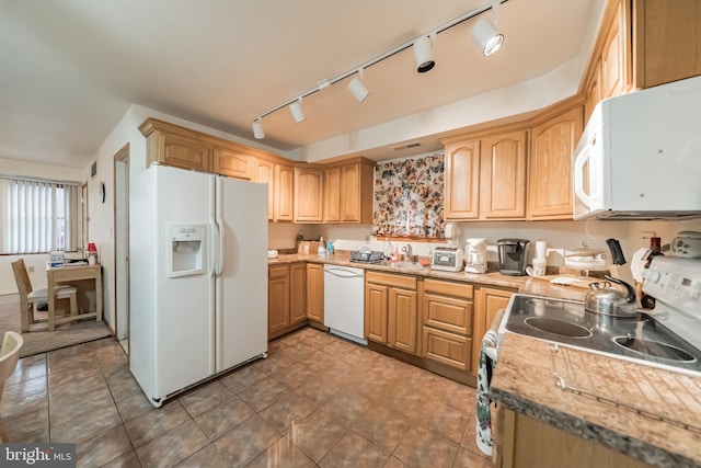 kitchen featuring sink and white appliances