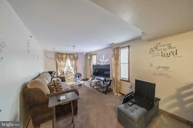 living room featuring a healthy amount of sunlight and carpet floors