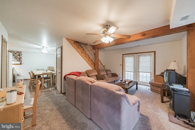 living room with carpet floors, french doors, and ceiling fan