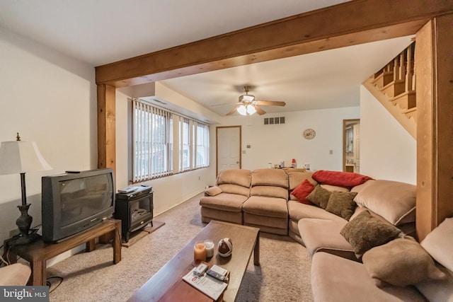 living room with ceiling fan and carpet