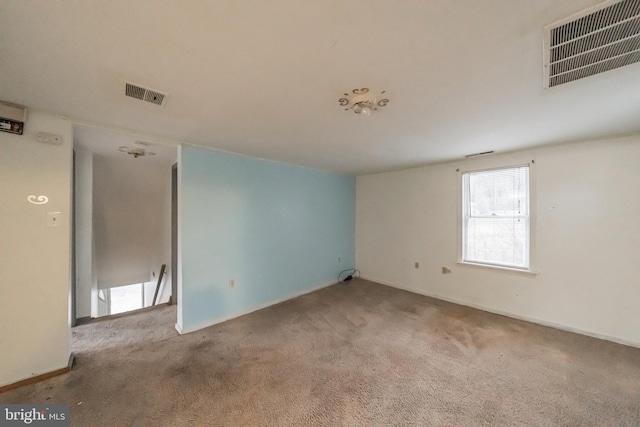 unfurnished room with light carpet