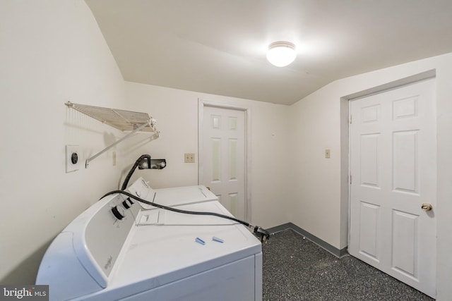 clothes washing area with washing machine and dryer