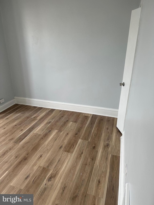 unfurnished room featuring wood-type flooring