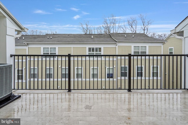 back of property featuring central air condition unit