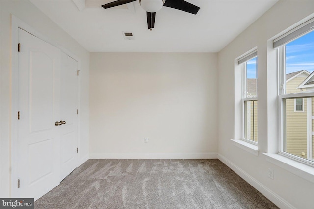 unfurnished bedroom featuring light colored carpet and ceiling fan