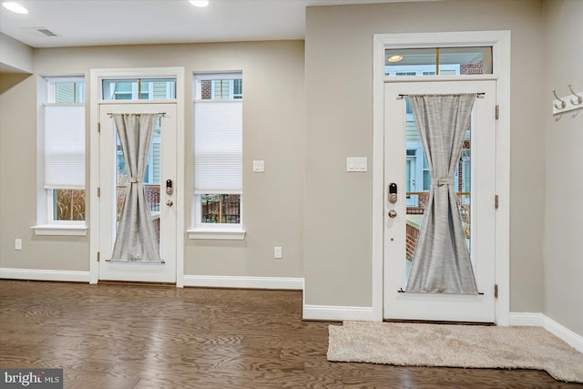 foyer with dark wood-type flooring