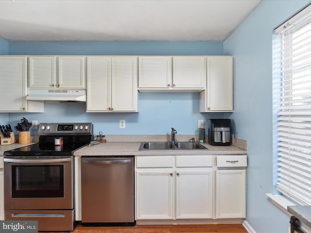 kitchen with white cabinets, sink, and stainless steel appliances