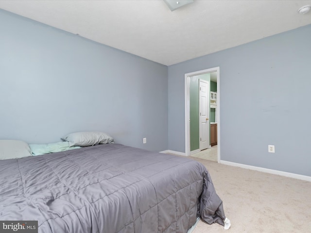 bedroom featuring light colored carpet