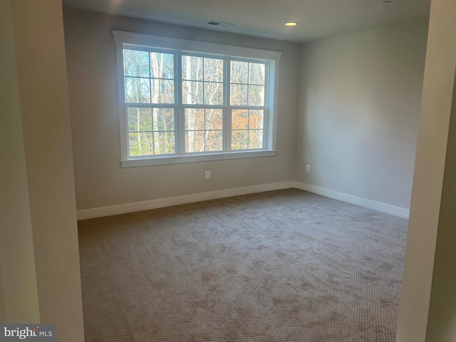 view of carpeted spare room