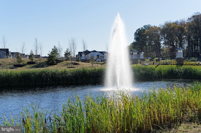 surrounding community featuring a water view