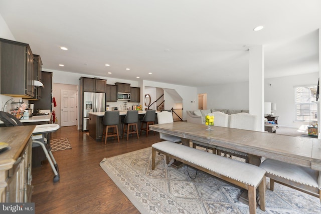 dining space with dark wood-type flooring