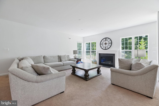 living room with a wealth of natural light and light carpet