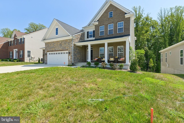 view of front of home with a front lawn, a porch, and a garage