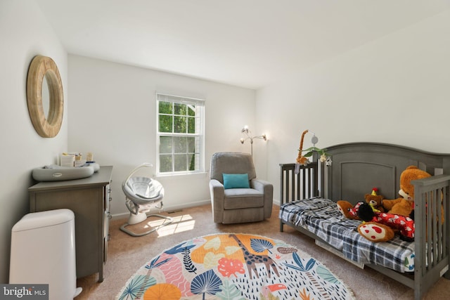 bedroom with light carpet