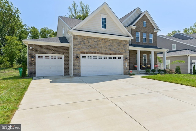 craftsman inspired home featuring a front lawn and a porch