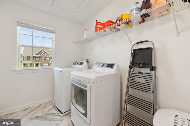 laundry room with washing machine and dryer