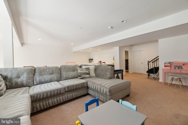 living room featuring light carpet