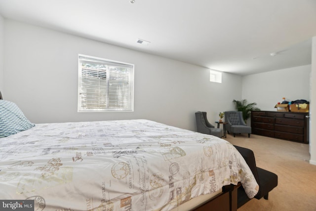 bedroom featuring light carpet