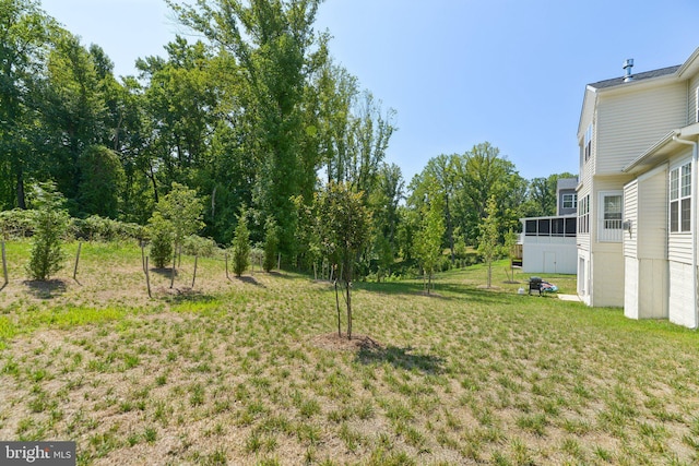 view of yard with a sunroom