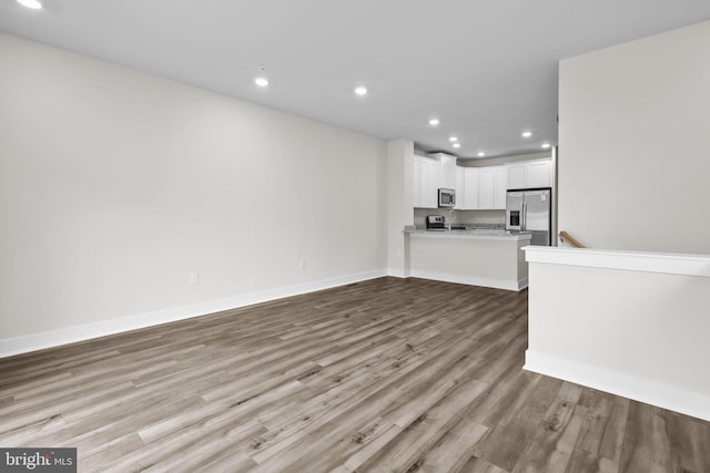 unfurnished living room featuring light hardwood / wood-style flooring